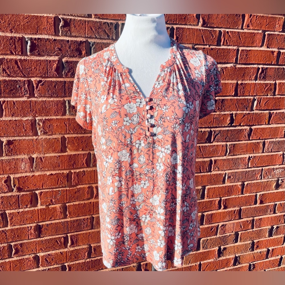 Liz Claiborne women’s size large. A light pink with a whole floral design.